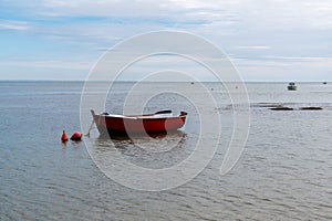 Small wooden fisherman boat Noirmoutier beach in France