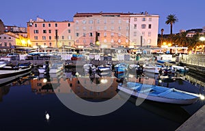 Small wooden fishing boats moored in Ajaccio port, Corsica , France.