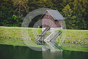 Small wooden house by the lake, Banska Stiavnica, Slovakia, Klinger