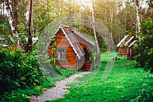 Small wooden house in sunny forest of Altay district