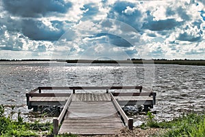 Small wooden jetty by a lake in the Netherlands