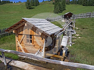 Small Wooden Mill in Operation during a Beautiful, Sunny Summer Day in the Mountains