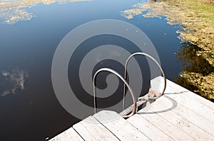 Small wooden pier near the river