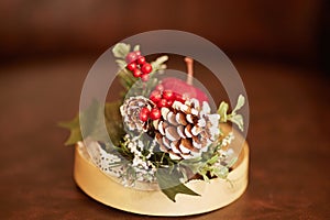 Small wooden plate with christmas decorations on