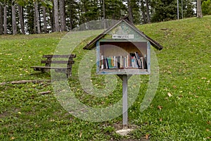 A small wooden public library, in a public park in Lizzano in Belvedere, Bologna, Italy photo