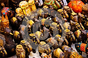 small wooden sculptures painted in gold of elephants in a shop in jaisalmer