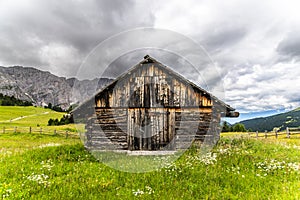 A small wooden shepherd's hut in the Dolomites, Italy