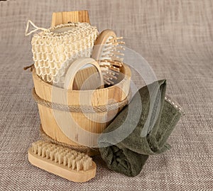 Small wooden spa set, sponge, pumice stone, a mirror, towel, brush, comb