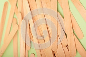 Small Wooden sticks on a green background