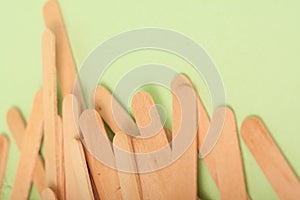 Small Wooden sticks on a green background