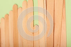 Small Wooden sticks on a green background