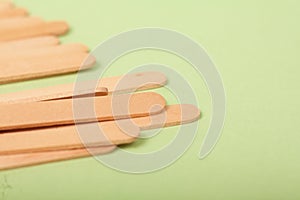 Small Wooden sticks on a green background