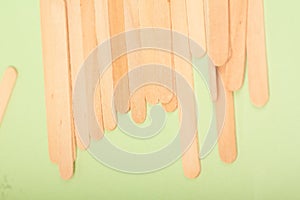 Small Wooden sticks on a green background