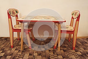 Small wooden table and two chairs