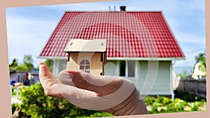 Small wooden toy house on palm of woman hand and big home on background. symbol and concept of cconstruction, buying
