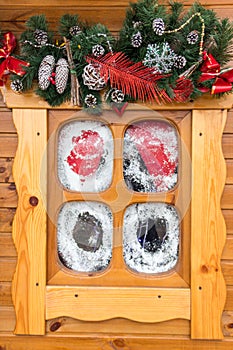 Small wooden window with Christmas decorations. Winter holidays concept