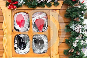 Small wooden window with Christmas decorations. Winter holidays concept