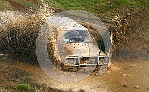 4x4 Offroad car in deep mud photo