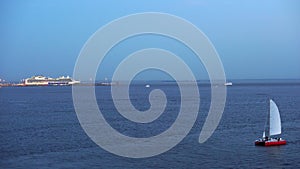 A small yacht sails in the Gulf of Finland during the white nights of St. Petersburg