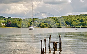 Small yacht and wooden posts on Windermere