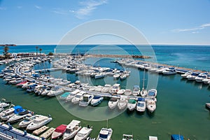 Small yachting port in the Mediterranean Sea on a summer day with clear blue sky