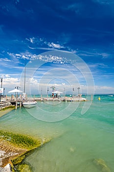 Small yachts in harbor in Desenzano, Garda lake, Italy