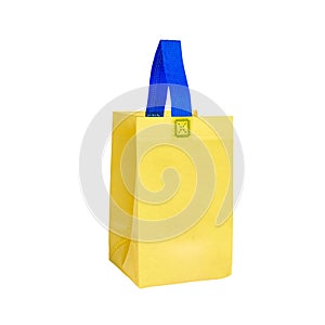 Small yellow canvas shopping bag isolated on white