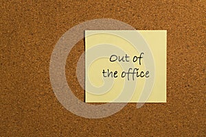 Small yellow sticky note on office noticeboard