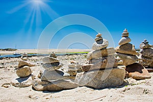 Small zen stone towers at the coast of Benodet on a summer day