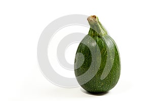 Small zucchini -cucurbita pepo- isolated on white. Copy space for text.