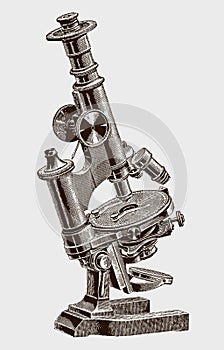 Smaller inclinable optical microscope with a revolving stage for mineralogical research photo