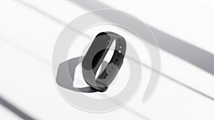 Smart activity fitness tracker on a white background the rays of the morning sun. Sport bracelet