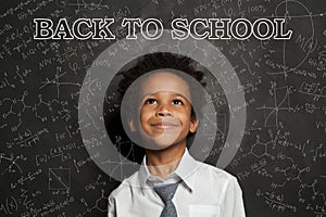 Smart African American child student boy smiling. Back to school concept