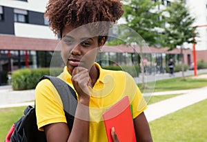 Smart african american female student outdoor on campus