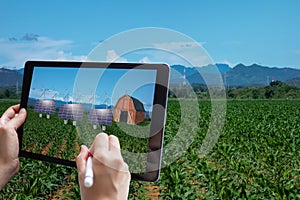 Smart agriculture , industry 4.0, 5.0 technology concept. farmer use augmented mixed virtual reality technology to manage and simu