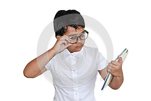 Smart asian boy wear glass look at the book isolate