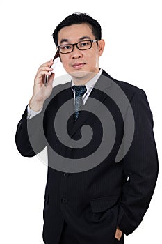 Smart Asian Chinese man wearing suit and holding mobile phone