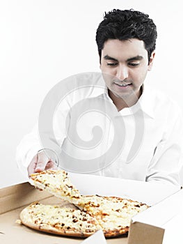 Smart asian man eating pizza