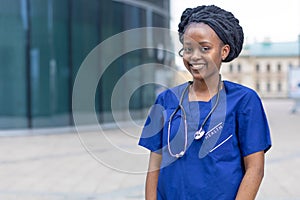 Smart black girl medical student, happy young african american woman doctor, nurse in blue uniform, stethoscope