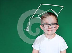 Smart Boy with Glasses, School Kid in Chalk Hat over Blackboard, Education Concept