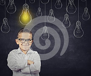 Smart boy with solution lightbulb above head