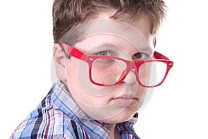 Smart boy wearing red glasses - isolated on white