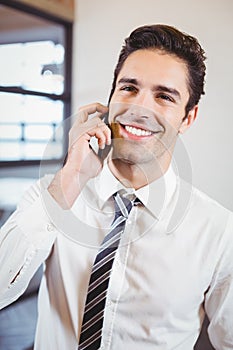 Smart business professional talking on mobile phone