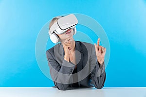 Smart business woman compare data analysis while using VR goggles. Contraption.