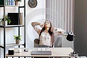 Smart business woman in formal suit outfit sitting and stretch relax in front of computer with happy and smile in modern office