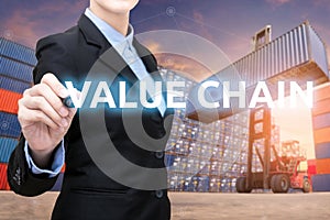 Smart business woman is writing value chain word