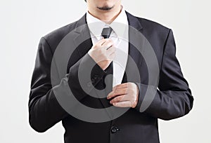 Smart Businessman adjust his tie before start with job