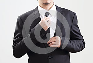 Smart Businessman adjust his tie before start with job photo