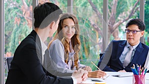 Smart businessman and businesswoman talking discussion in group meeting