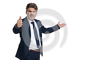 Smart businessman gesturing ok and presenting while smiling